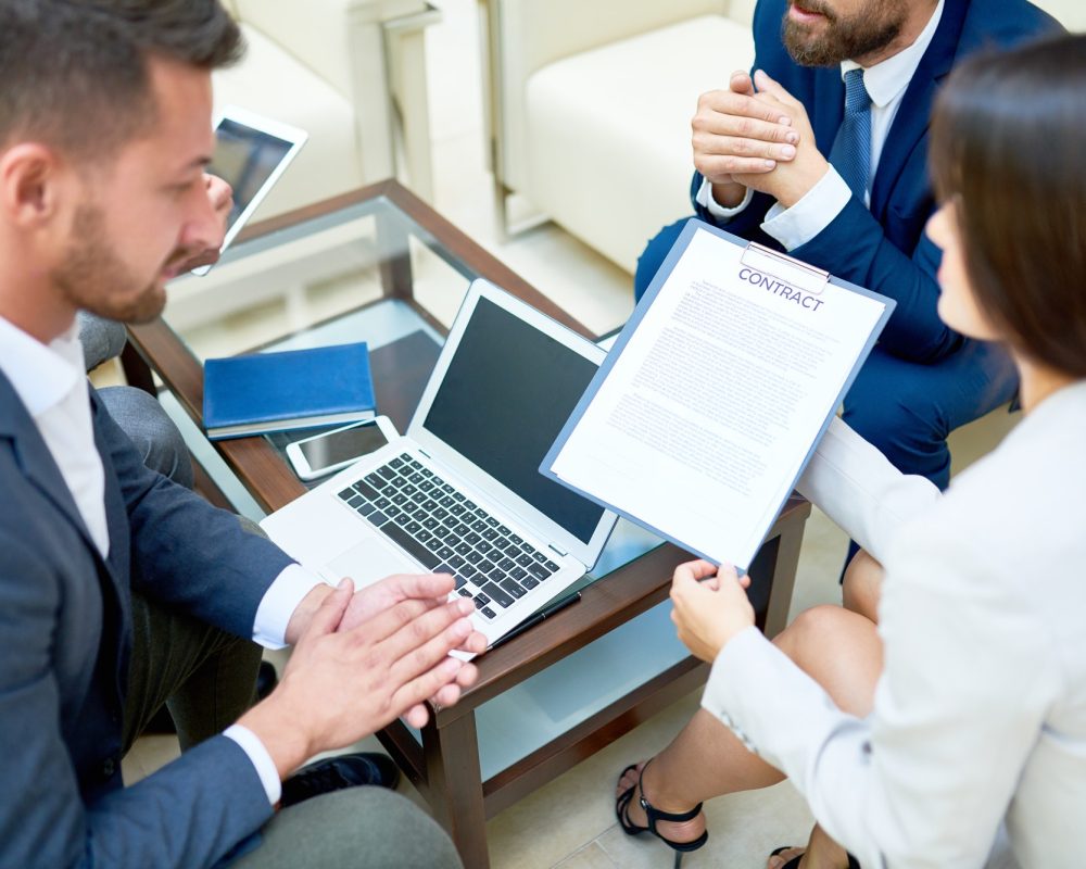 partners-discussing-business-contract-in-meeting.jpg partners-discussing-business-contract-in-meeting.jpg